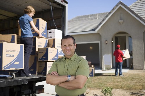 Packed boxes and household items ready for van removal