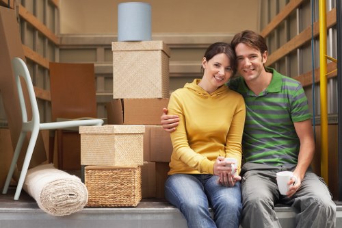 Boxes and furniture being loaded by a Chasecross moving service