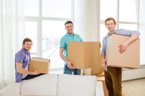 Packed moving boxes and furniture ready for transport