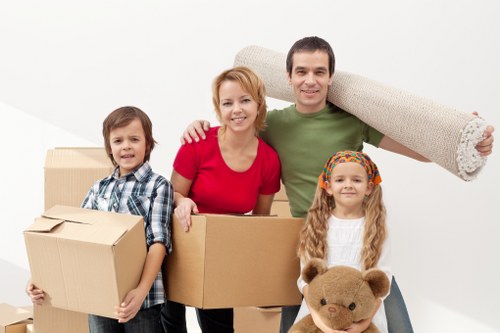 Furniture and boxes being unloaded into a new home during a Chasecross move