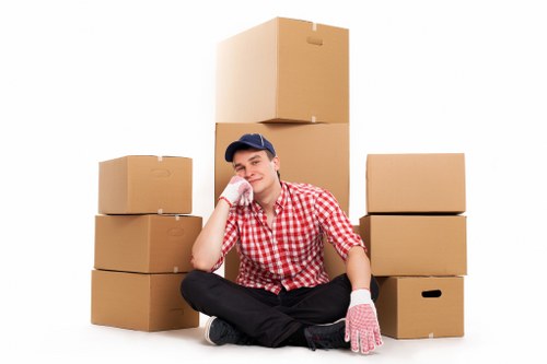Careful loading of household items into a removals van